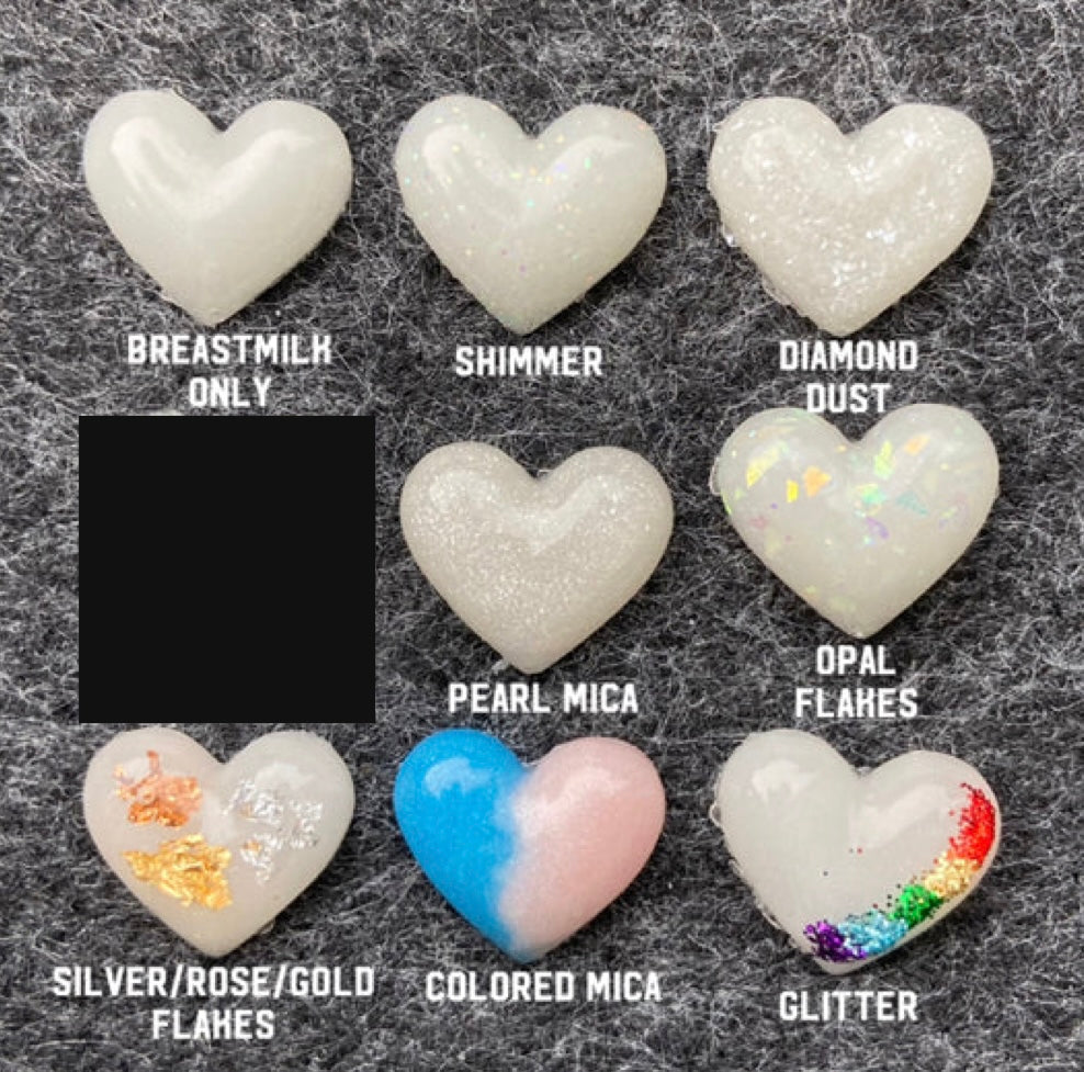 Heart shapes with breastmilk and glitter add ins to show what it will look like in jewelry.