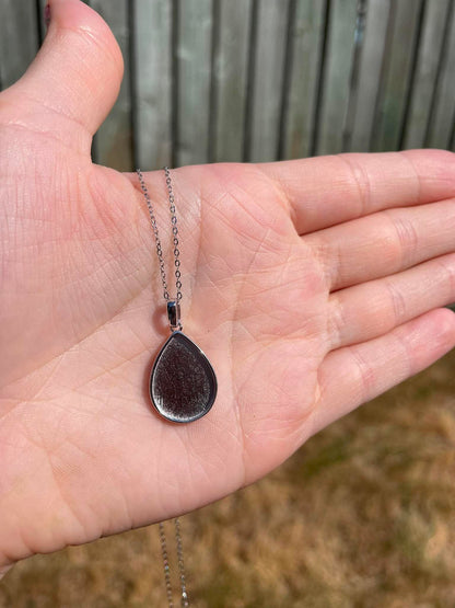 Necklace Drop By Drop  A Drop In Time Keepsakes shown on palm of hand to show size.